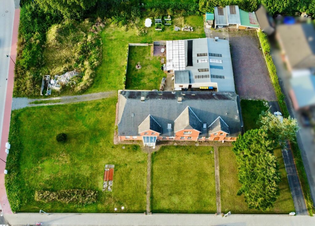Luftbild Entwicklungsgrundstück Owschlag mit Mehrfamilienhaus und Nebengebäuden